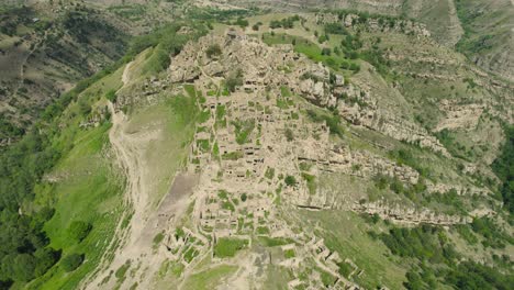 aerial view of an ancient, abandoned village nestled in a mountain valley