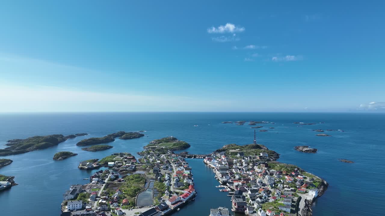 Horizon and blue sky in summer between Henningsvær village in Lofoten, aerial