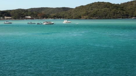 Yachts-moored-at-idyllic-sea-channel-on-tropical-island