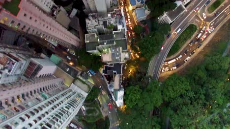 hong kong, birdseye drone aerial view, skyscrapers and busy evening traffic jam