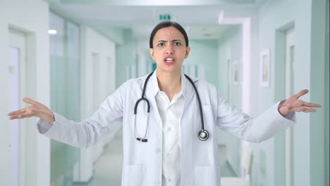 angry indian female doctor shouting to the camera