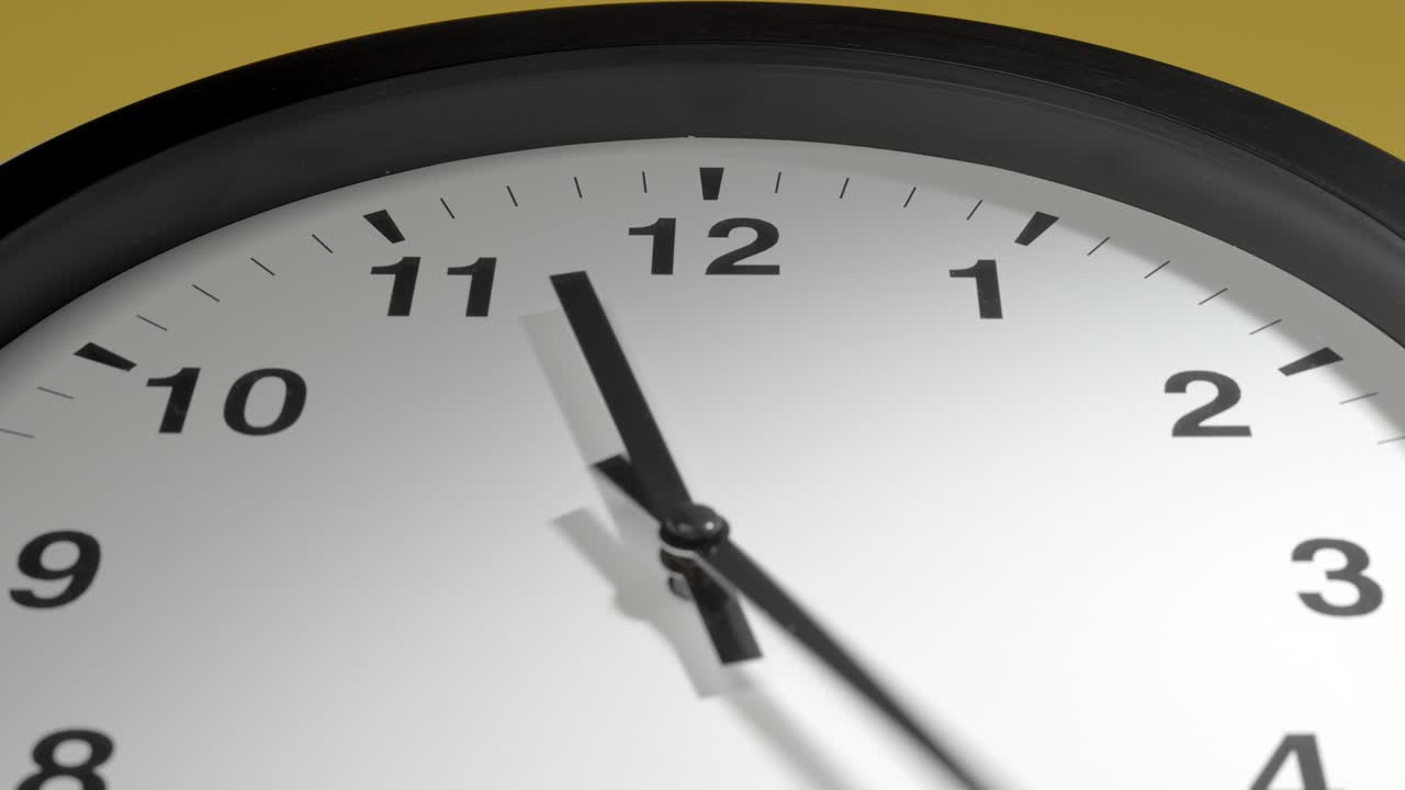 Clock Face on Yellow Wall in Time Lapse
