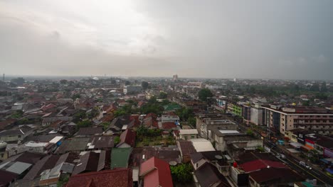 aerial view of a densely populated city under overcast skies