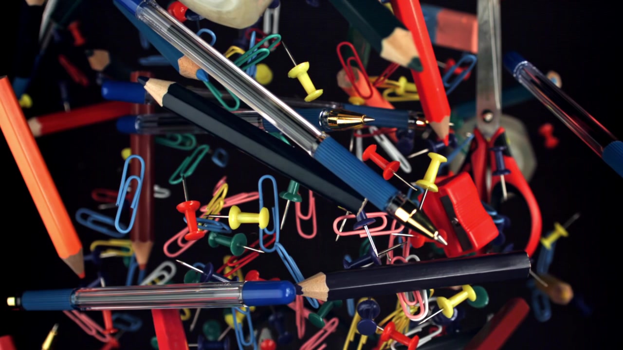 Colorful Office and School Supplies Floating in Slow Motion