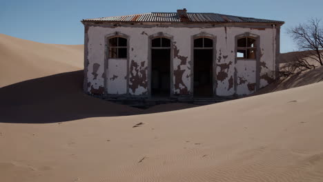 abandoned building in the desert sands of kolmanskop