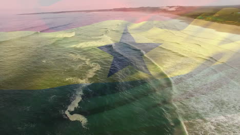 digital composition of waving ghana flag against against aerial view of the sea waves