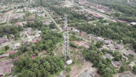 aerial circling shot of telecommunication tower in pasir besar, malaysia