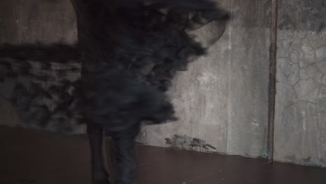 woman dancing in a black flowing dress