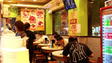 diners enjoying meals in a bustling restaurant