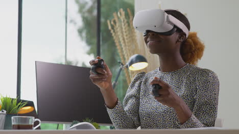 Woman-Working-From-Home-Office-With-Controllers-Wearing-VR-Headset-Interacting-With-AR-Technology