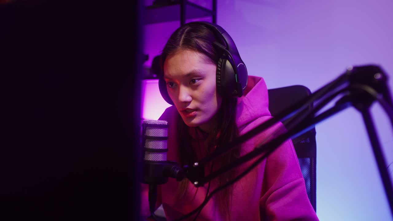 Woman streaming with microphone and headphones