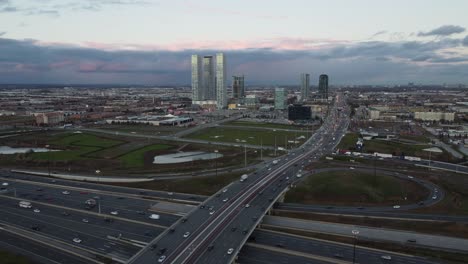 Aerial-view-of-Highway-7-and-Highway-400-in-Vaughan,-Canada-as-a-Sea-gull-tries-to-attack-the-camera