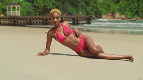 in the caribbean paradise, a young woman of african descent delights in the sun, clad in a red bikini