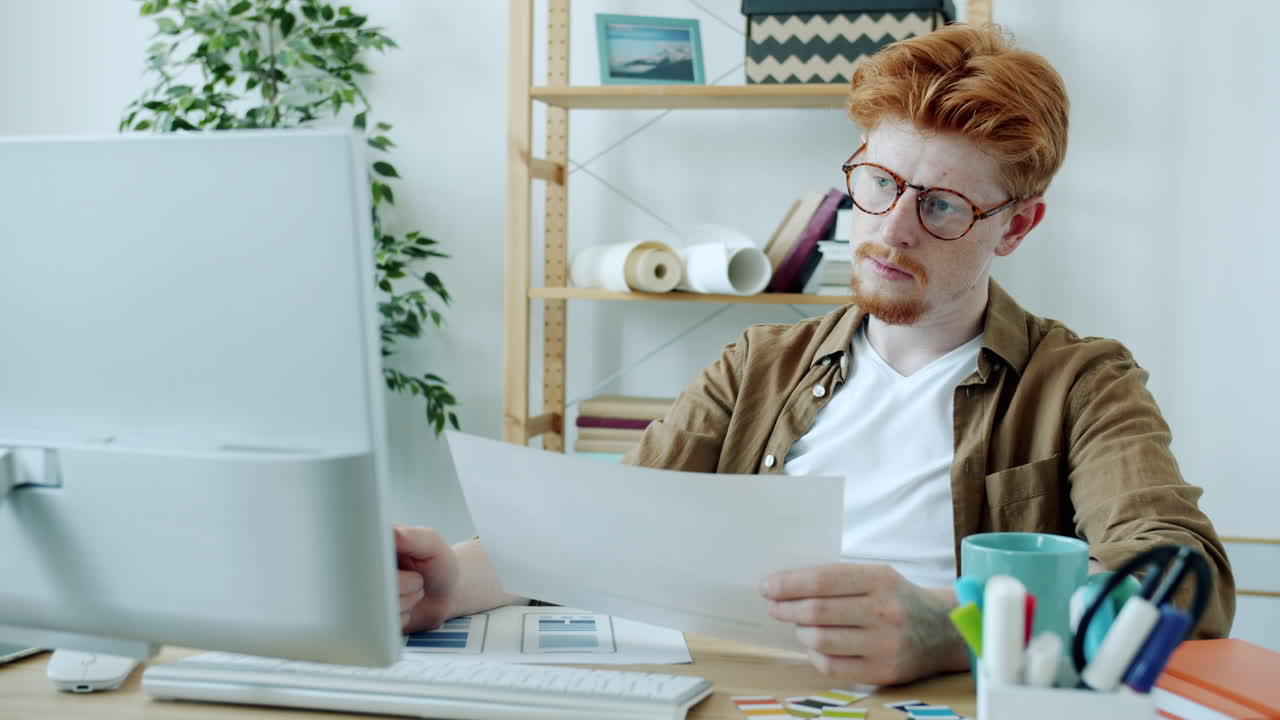 Man working at his computer on design project