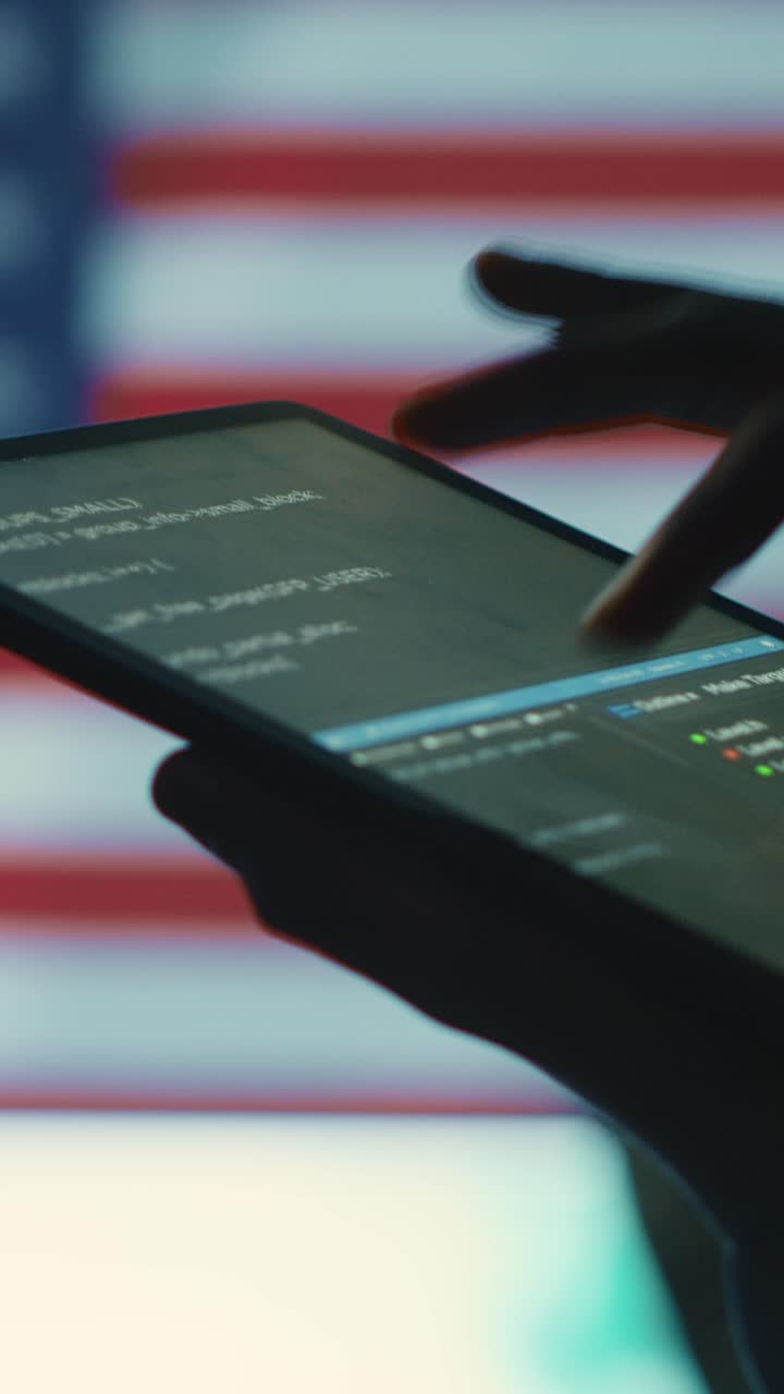 Programmer's Hands Scrolling Code on a Digital Tablet