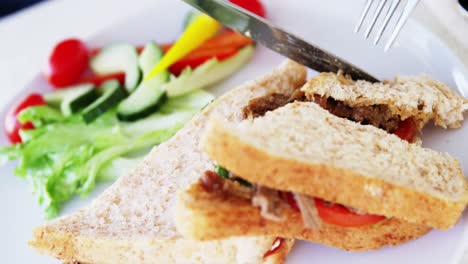 closeup of sandwich being sliced