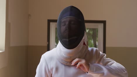 fencer athlete during a fencing training in a gym