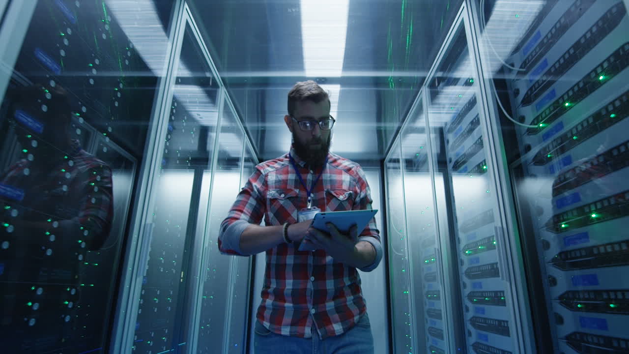IT professional working with a tablet in a data center