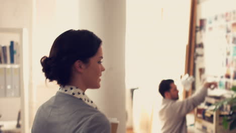 businesswoman-walking-through-her-office