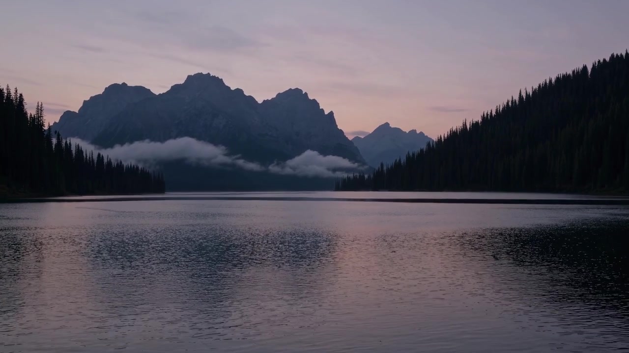 Serene Mountain Lake with Pine Forest and Clouds at Dusk