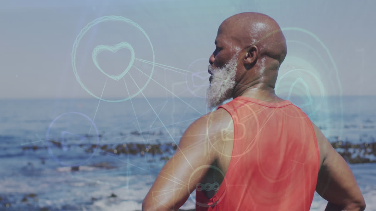 Animazione di rete di icone digitali su uomo anziano afroamericano in piedi vicino al mare.