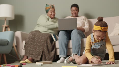 two women and child spending weekend at home