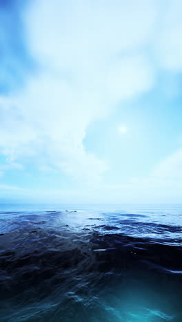 large body of water under cloudy blue sky