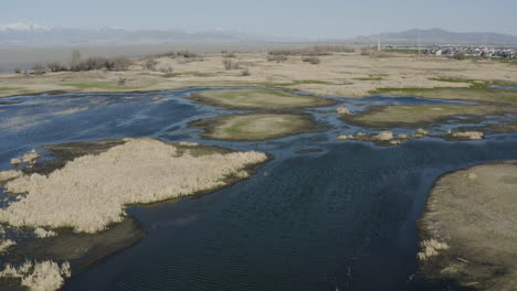 powell slough wetlands of utah lake during summer drought - aerial