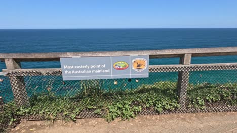 slow pan across a coastal viewpoint sign