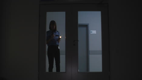 woman in uniform searching on the hallway