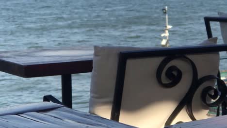 decorative chair at cafe with a danube river in background