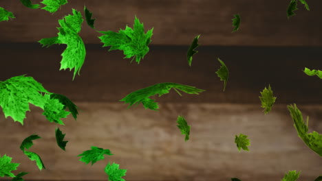 animation of multiple green leaves falling over brown background
