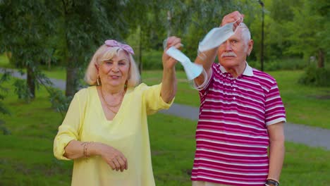 quarantine coronavirus is over, senior old family grandparents take off medical masks, celebrate