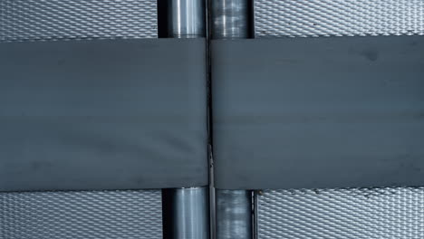 closeup empty conveyor belt moving at modern automated manufacturing facility