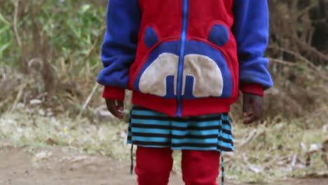 lonely kid walking in parts of south of kenya