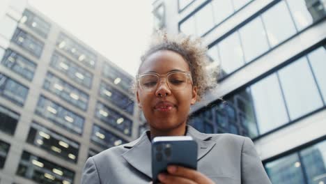 businesswoman using smartphone in city