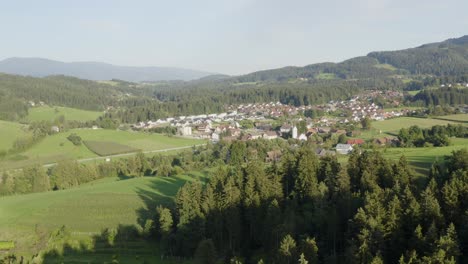 Aerial-view-of-Kotjle-town-from-far-away-with-forest-foreground