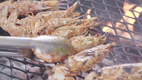 shrimp on barbeque being turned over