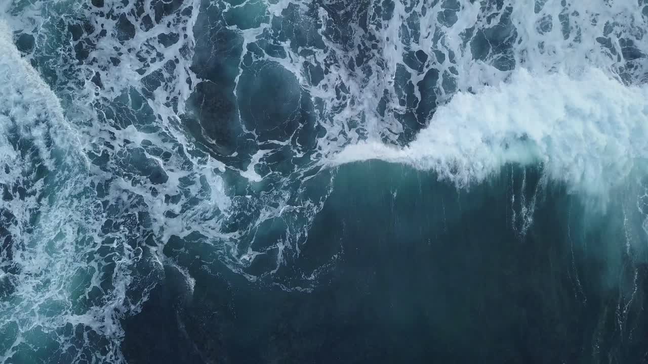 overhead drone shot of sea waves on the Hindia Ocean