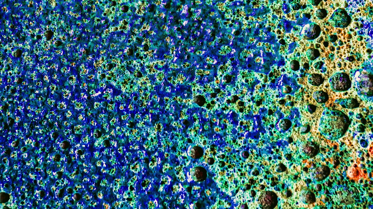 Abstract Close-up of Bubbling Blue and Green Liquid Surface