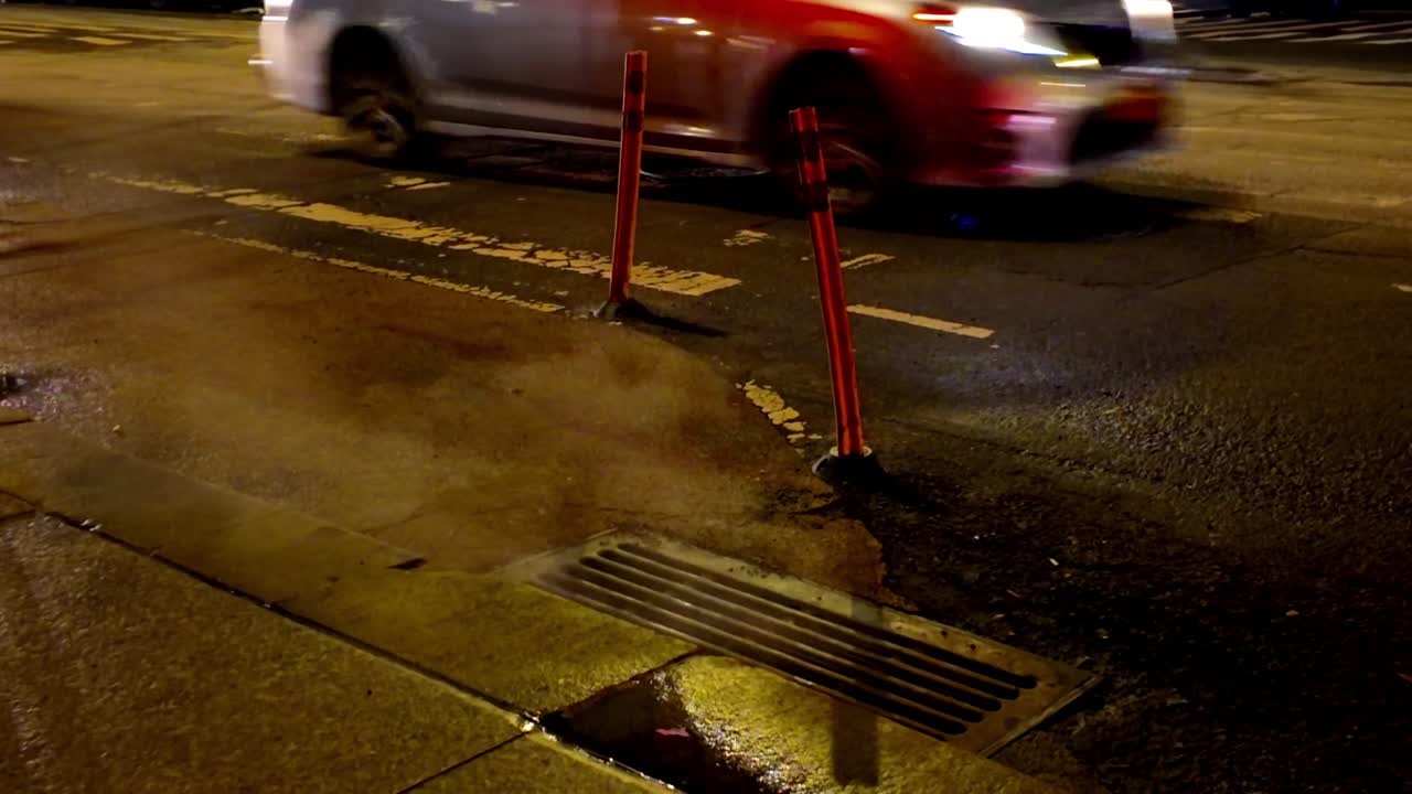Steam Rising from a Manhole Cover on Sidewalk in New York City Steam Coming Out of a Vent