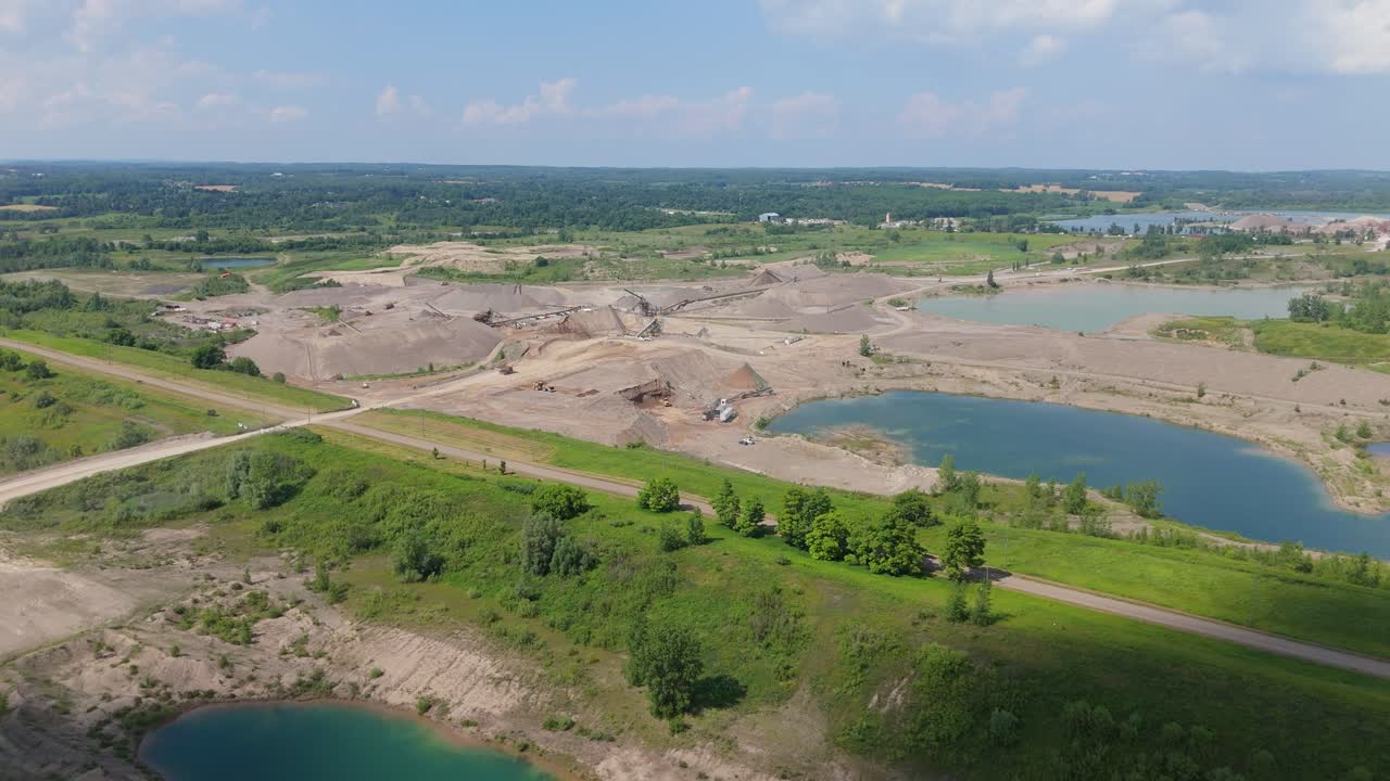 Expansive gravel pit landscape in Caledon, Ontario, aerial dolly establishing