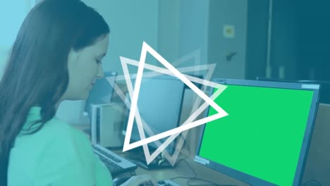 Animation-of-triangles-spinning-over-female-student-using-computer-with-green-screen