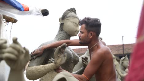 durga puja: artisans craft clay idols