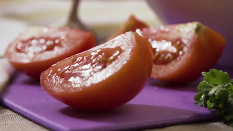 sliced tomatoes on a purple cutting board