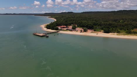 overhead aerial vertical moving clip of remote community coastline in northern australia