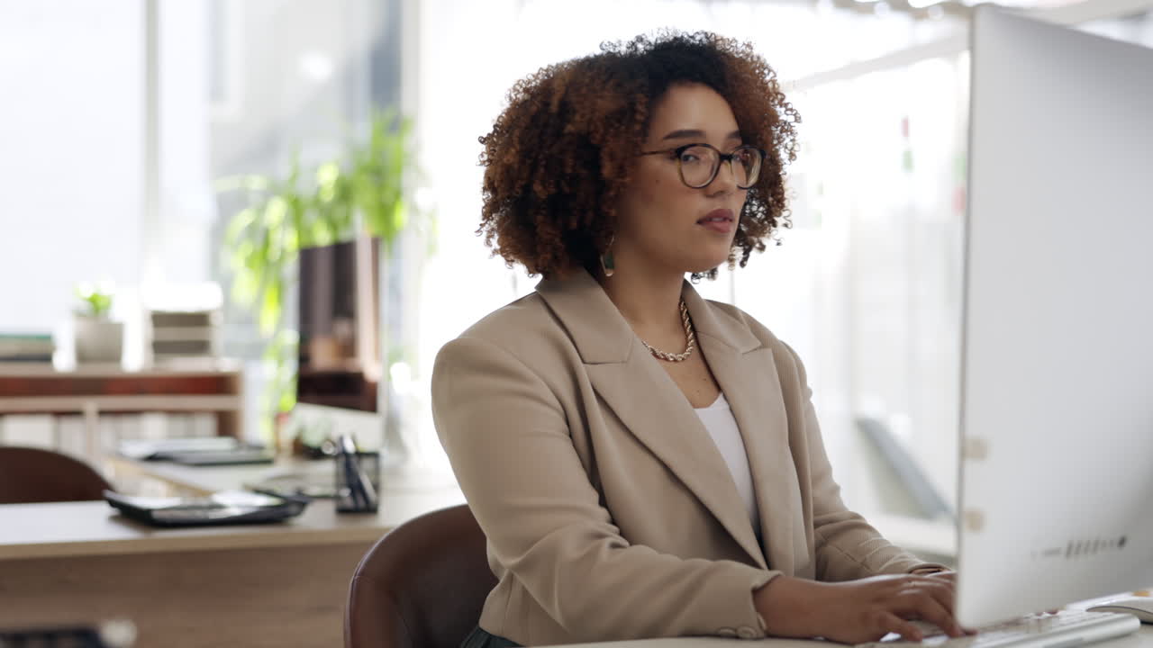 Black woman, office and typing on computer