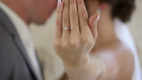 bride showing wedding ring in front of camera, close up