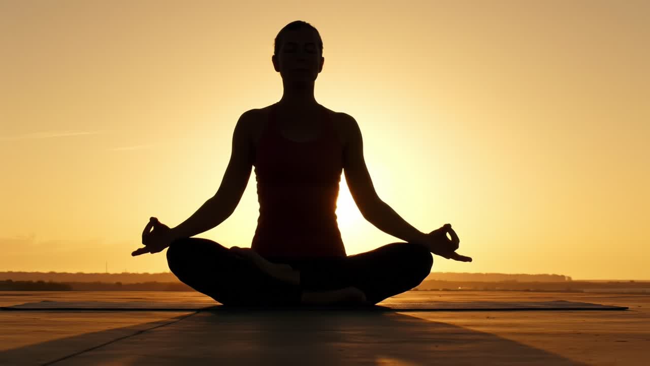 A Serene Yoga Session at Sunset Captures the Essence of Mindfulness and Meditation as the Silhouette of an Individual Reflects Inner Peace and Tranquility