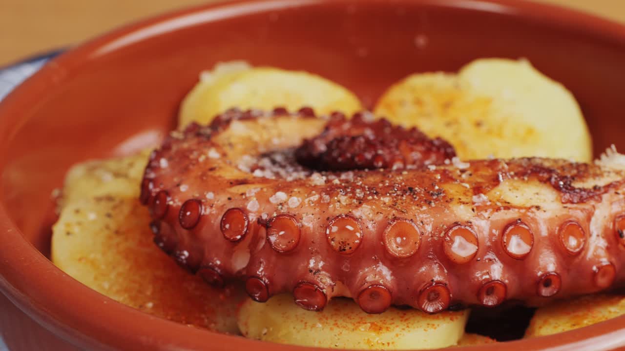Octopus cooking, chef grill fresh octopus galician style on restaurant kitchen, healthy food, seafood cafe in spain, traditional asian japanese spanish and mediterranean dish.